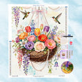 5D Diamant Kunst Motiv eines schwebenden Blumenkorbs mit bunten Blüten, Perlen und zwei fliegenden Kolibris im Aquarell-Stil