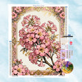 Diamond Painting Motiv von zarten rosa Trompetenblumen in einem prunkvollen goldenen Barock-Rahmen