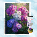 5D Diamond Painting Motiv: Ein üppiges Arrangement aus Phlox-Blüten in sanften Blau-, Lila-, Pink- und Weißtönen, getaucht in weiches, romantisches Sonnenlicht.
